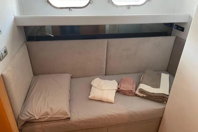  Yacht Photos Pics Cozy cabin bed with folded linens on Sanlorenzo SL72 yacht, 2010 model.