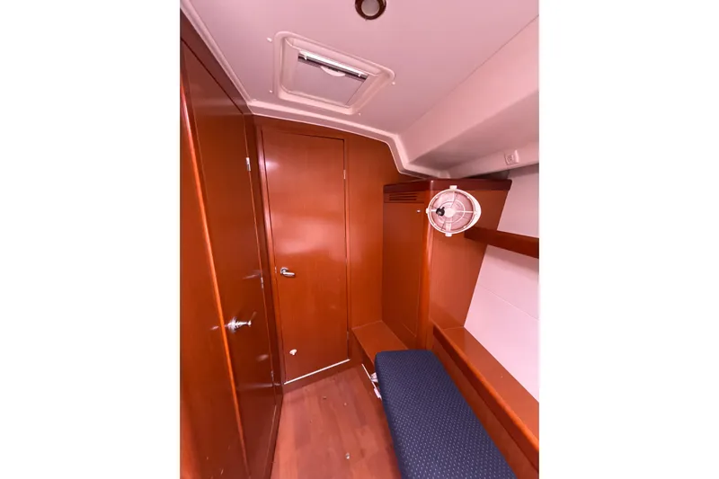 Vision 360 Yacht Photos Pics Interior of 2012 Beneteau First 435 sailboat, featuring wooden cabinetry and seating.