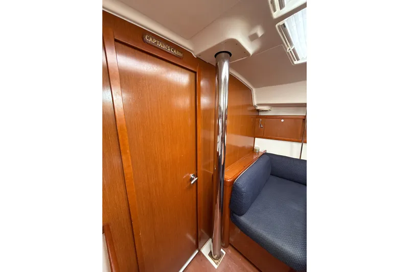 Vision 360 Yacht Photos Pics Interior of 2012 Beneteau First 435 yacht, featuring captain's cabin door and seating area.