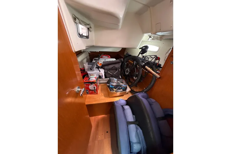 Vision 360 Yacht Photos Pics Interior of 2012 Beneteau First 435 sailboat with stored equipment and bicycle.