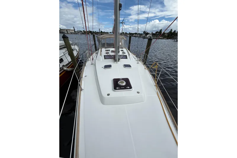 Vision 360 Yacht Photos Pics Beneteau First 435 sailboat deck, 2012 model, docked at marina under cloudy sky.