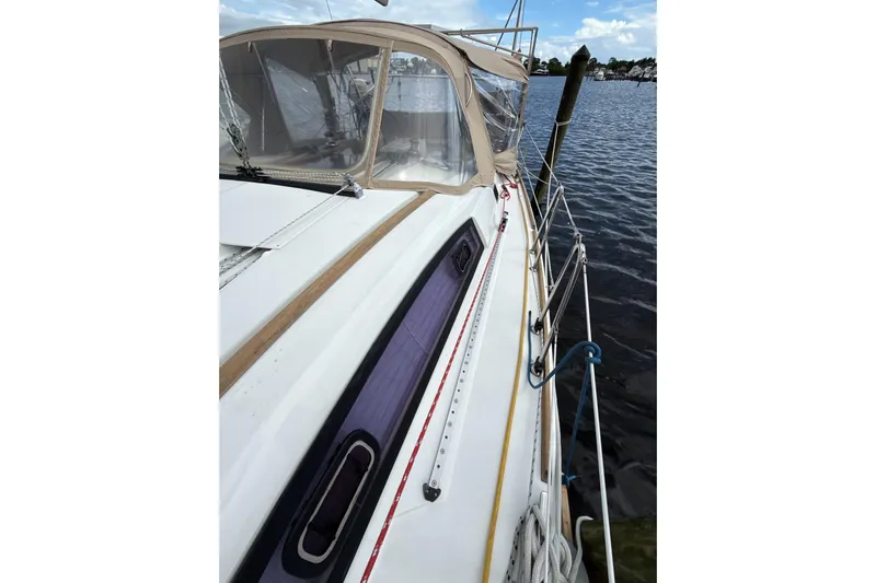 Vision 360 Yacht Photos Pics Beneteau First 435 sailboat, 2012 model, docked with beige canopy and visible rigging.