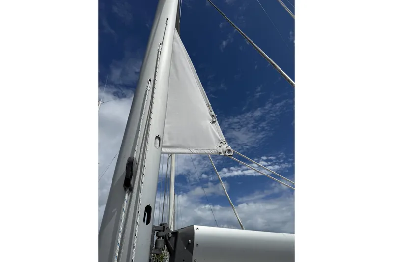 Vision 360 Yacht Photos Pics Sailboat mast and sail against a blue sky, Beneteau First 435, 2012 model.
