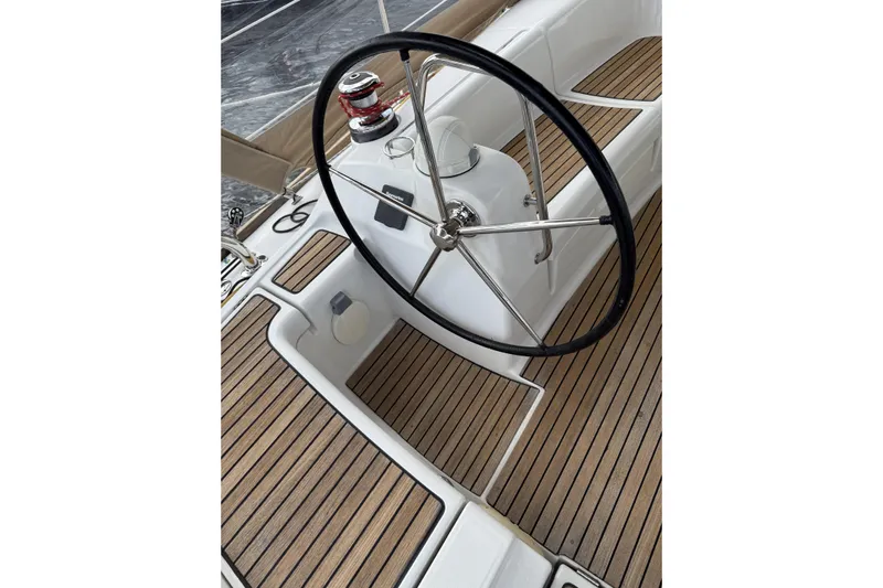 Vision 360 Yacht Photos Pics Steering wheel of 2012 Beneteau First 435 yacht with teak deck.
