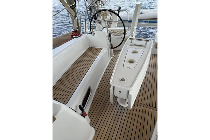 Vision 360 Yacht Photos Pics Cockpit of 2012 Beneteau First 435 sailboat with teak flooring and steering wheel.