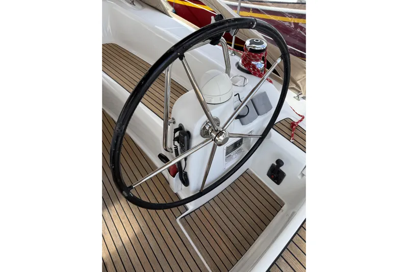Vision 360 Yacht Photos Pics Steering wheel of a 2012 Beneteau First 435 yacht with teak deck.