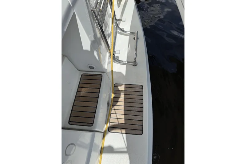 Vision 360 Yacht Photos Pics Beneteau First 435 yacht deck, 2012 model, featuring teak flooring and stainless steel railings.