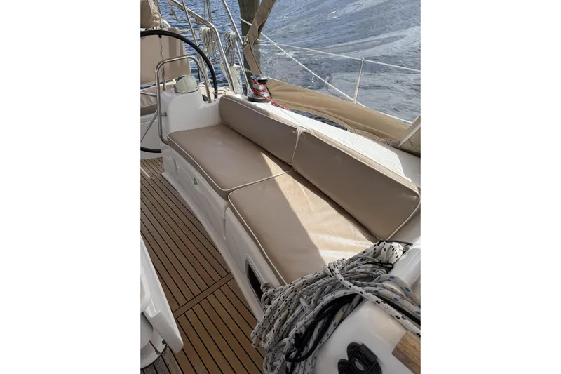 Vision 360 Yacht Photos Pics Beneteau First 435 sailboat cockpit with cushioned seating, teak flooring, and nautical ropes, 2012 model.