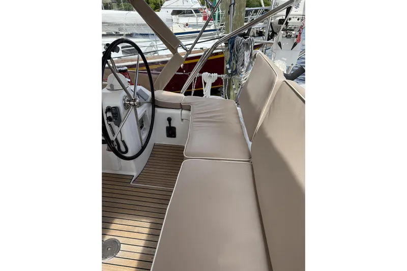 Vision 360 Yacht Photos Pics Beneteau First 435 yacht cockpit with beige cushions and steering wheel, 2012 model.