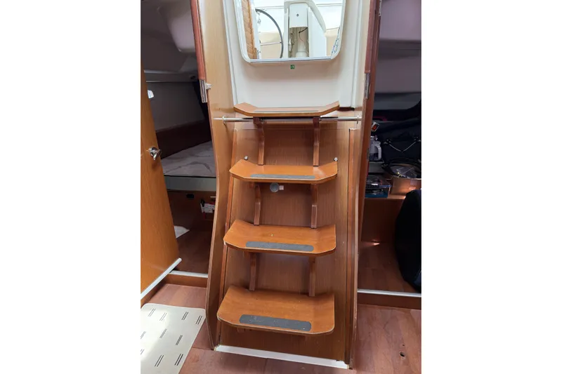 Vision 360 Yacht Photos Pics Interior of 2012 Beneteau First 435 yacht with wooden steps and cabin view.