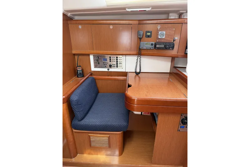 Vision 360 Yacht Photos Pics Interior of 2012 Beneteau First 435 yacht with navigation station and seating area.