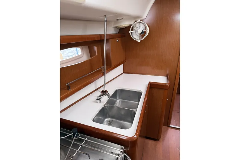 Vision 360 Yacht Photos Pics Beneteau First 435 yacht kitchen interior with dual sinks, wood finish, and compact design, 2012 model.