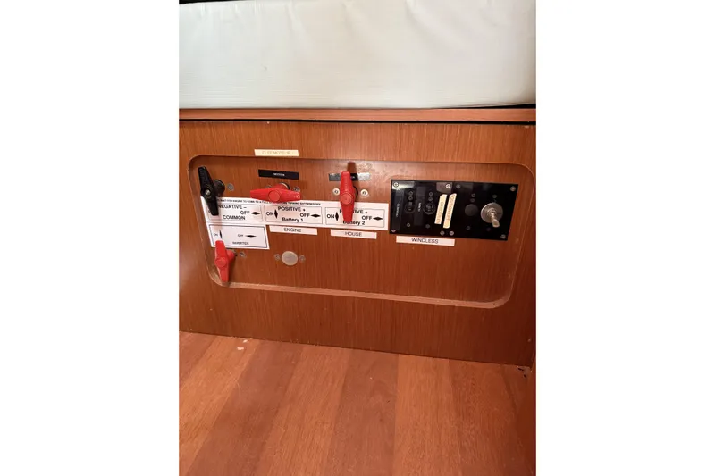 Vision 360 Yacht Photos Pics Control panel of a 2012 Beneteau First 435 sailboat, featuring labeled switches and controls.