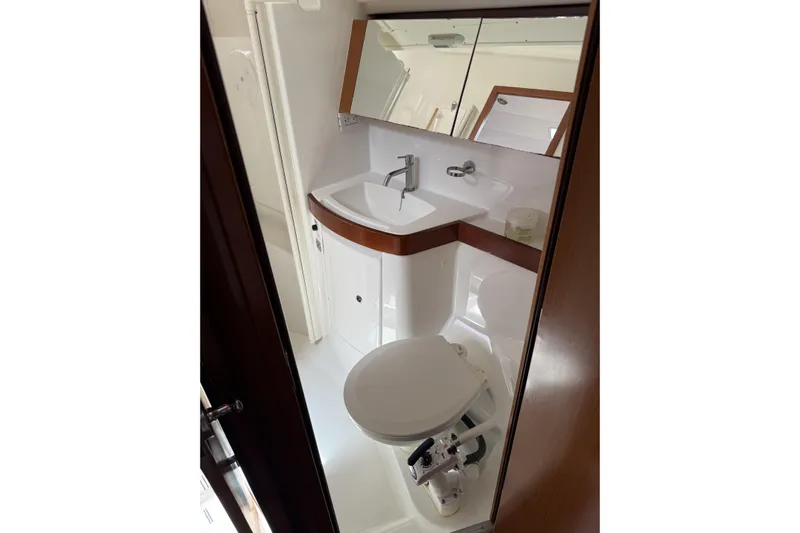 Vision 360 Yacht Photos Pics Beneteau First 435 2012 yacht bathroom with sink, mirror, and toilet.