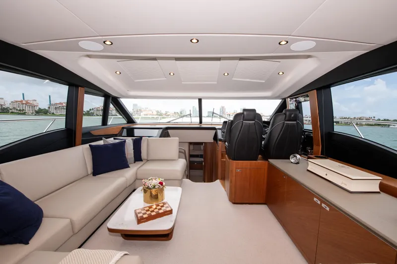 Wheelhouse Yacht Photos Pics Luxurious interior of 2021 Princess S66 yacht with elegant seating and modern design.