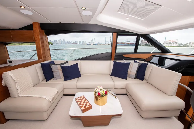 Wheelhouse Yacht Photos Pics Luxurious interior of 2021 Princess S66 yacht with elegant seating and scenic water view.