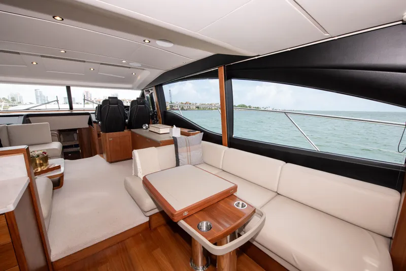 Wheelhouse Yacht Photos Pics Luxurious interior of 2021 Princess S66 yacht with elegant seating and ocean view.