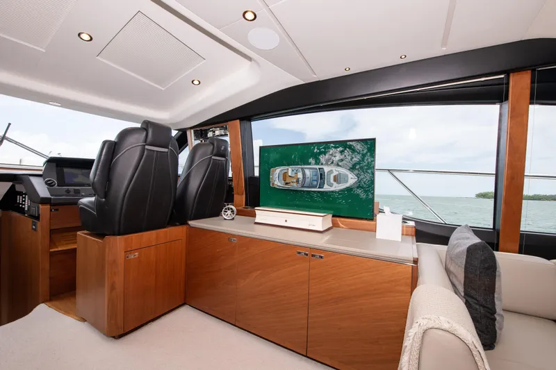 Wheelhouse Yacht Photos Pics Luxurious interior of 2021 Princess S66 yacht with modern seating and ocean view.