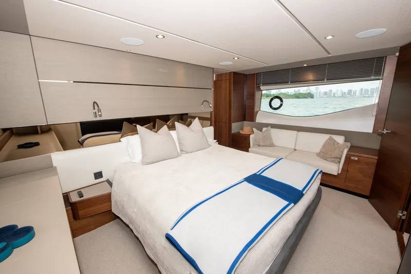 Wheelhouse Yacht Photos Pics Luxurious bedroom interior of 2021 Princess S66 yacht with modern design and elegant furnishings.