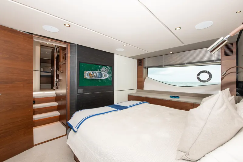 Wheelhouse Yacht Photos Pics Luxurious bedroom interior of 2021 Princess S66 yacht with modern design and ocean view.