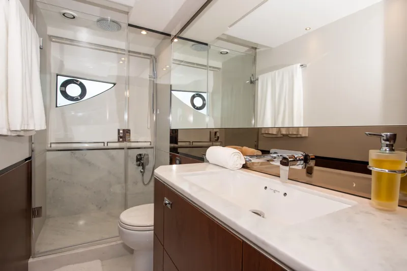 Wheelhouse Yacht Photos Pics Luxurious bathroom interior of 2021 Princess S66 yacht with modern fixtures and elegant design.