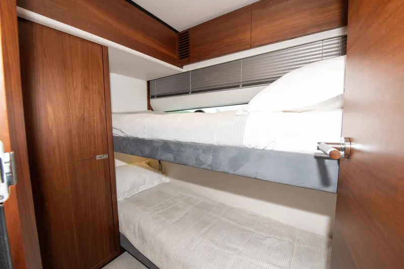 Wheelhouse Yacht Photos Pics Bunk beds in 2021 Princess S66 yacht cabin with wooden interior.