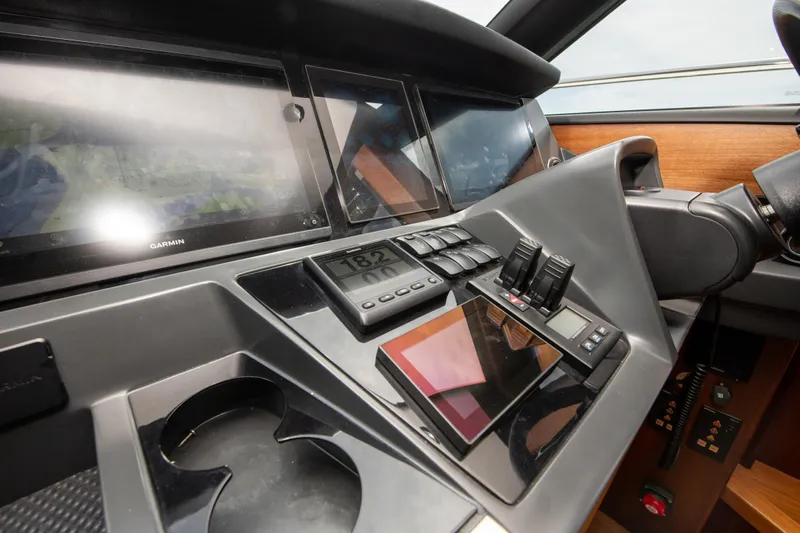 Wheelhouse Yacht Photos Pics Control panel of a 2021 Princess S66 yacht with modern navigation equipment.