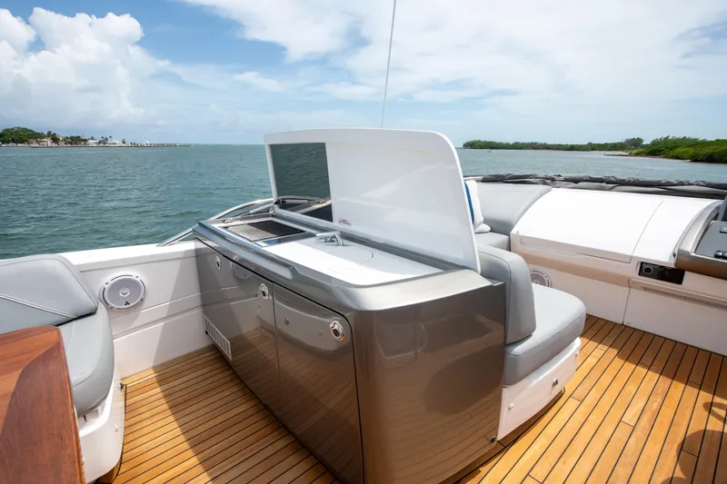 Wheelhouse Yacht Photos Pics Luxury yacht Princess S66 2021 with sleek deck and ocean view.