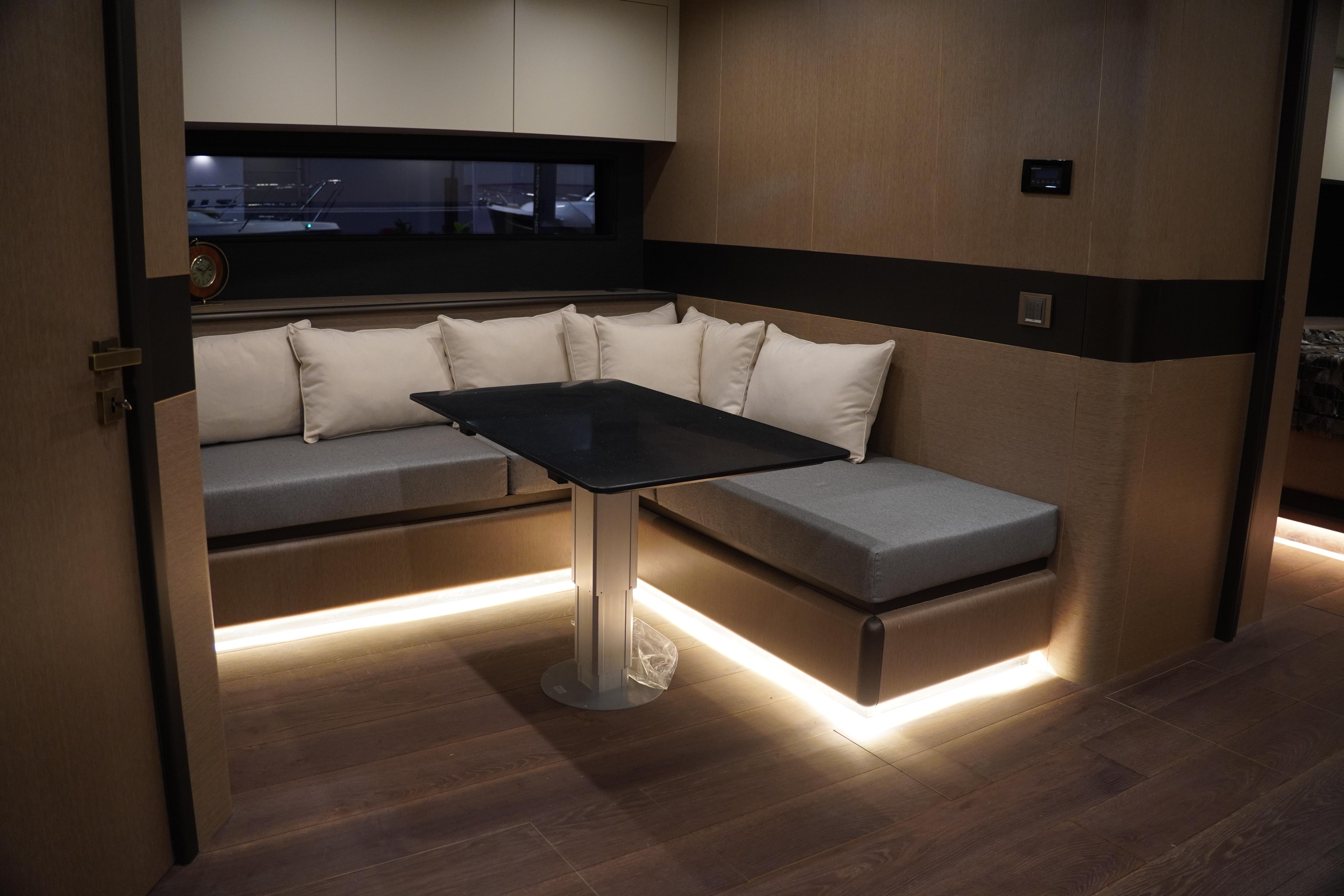 Luxurious interior of 2026 Phantom Spook Fly 62 yacht with modern seating and ambient lighting.