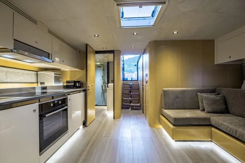  Yacht Photos Pics Luxurious interior of 2026 Phantom Spook Fly 62 yacht with modern kitchen and seating area.