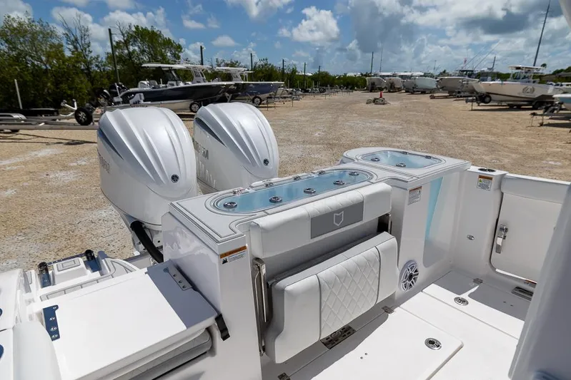  Yacht Photos Pics 2026 Sea Fox 288 Commander boat with dual engines, docked in a sunny marina.