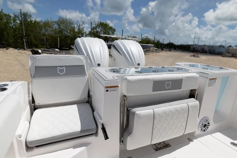  Yacht Photos Pics 2026 Sea Fox 288 Commander boat interior with white seating and dual engines.