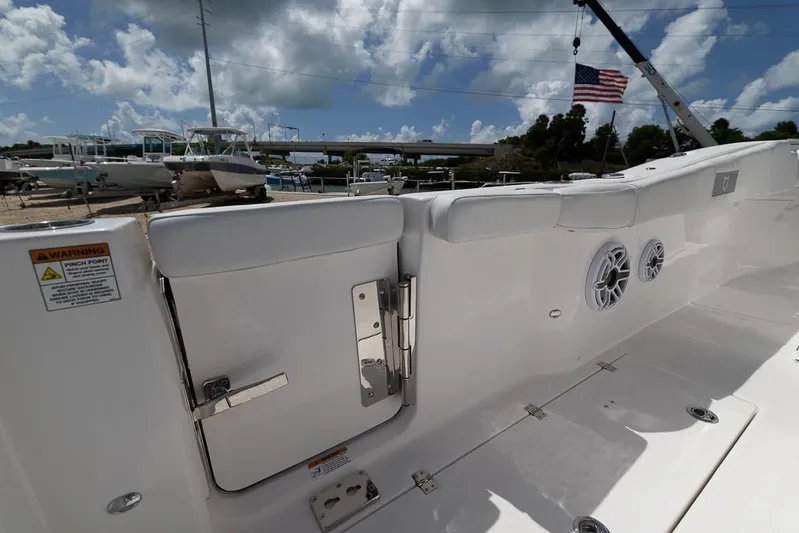  Yacht Photos Pics 2026 Sea Fox 288 Commander boat interior with speakers and American flag in background.