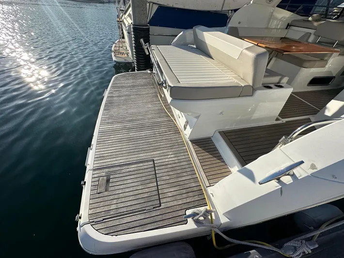 Le Bon Vie Yacht Photos Pics 2016 Jeanneau Leader 36 yacht with spacious deck and seating area by the water.