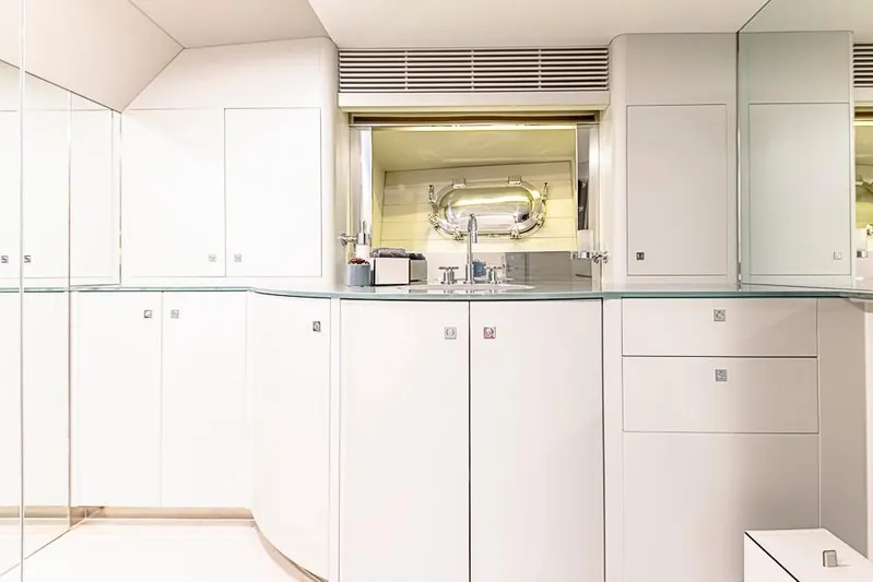 My Star Yacht Photos Pics Luxurious white interior of 1994 Alloy Yachts Sloop, featuring sleek cabinetry and modern fixtures.