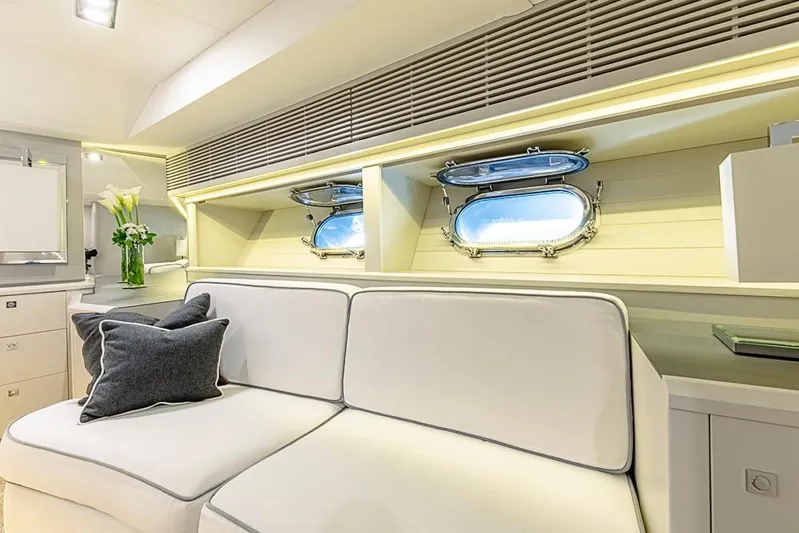 My Star Yacht Photos Pics Luxurious interior of 1994 Alloy Yachts Sloop with white seating and porthole windows.