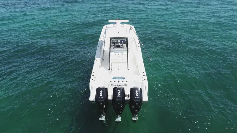  Yacht Photos Pics 2025 Caymas 341 CC boat with triple engines on open water.