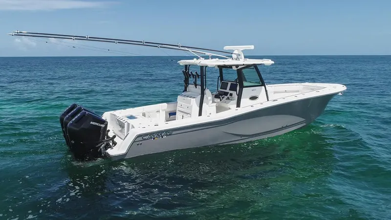  Yacht Photos Pics 2025 Caymas 341 CC boat on open ocean, featuring dual outboard motors.
