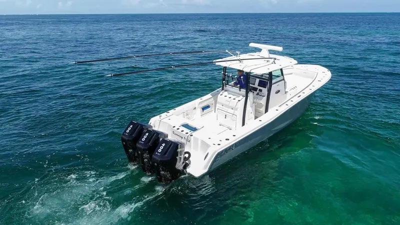  Yacht Photos Pics 2025 Caymas 341 CC boat cruising on clear blue ocean waters.