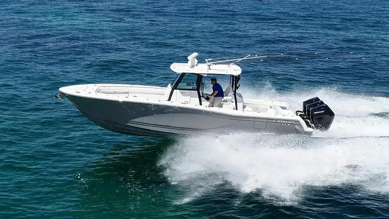  Yacht Photos Pics 2025 Caymas 341 CC boat cruising on open water, showcasing speed and performance.