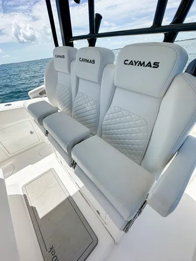  Yacht Photos Pics 2025 Caymas 341 CC boat with luxurious white seating on open water.
