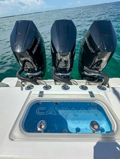  Yacht Photos Pics 2025 Caymas 341 CC boat with triple Mercury engines on the ocean.