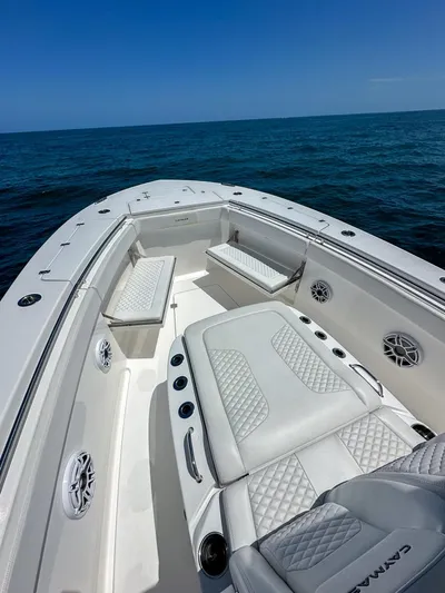  Yacht Photos Pics 2025 Caymas 341 CC boat with luxurious seating on open water.