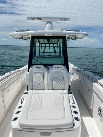  Yacht Photos Pics 2025 Caymas 341 CC boat with luxurious seating and Garmin electronics on open water.