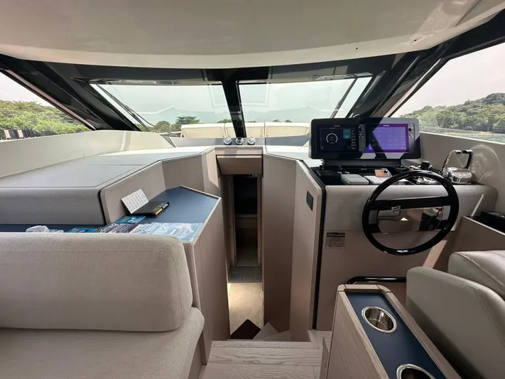  Yacht Photos Pics Interior of 2023 Ferretti Yachts 500, featuring modern helm and luxurious seating.