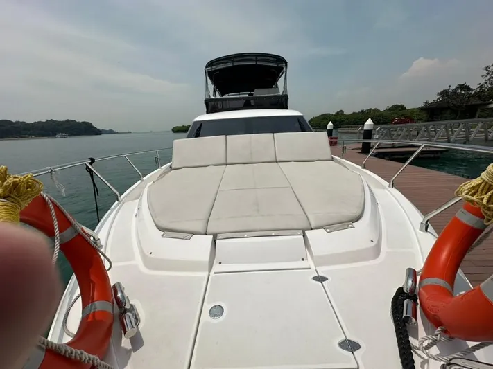  Yacht Photos Pics 2023 Ferretti Yachts 500 on water, featuring spacious deck and luxurious design.