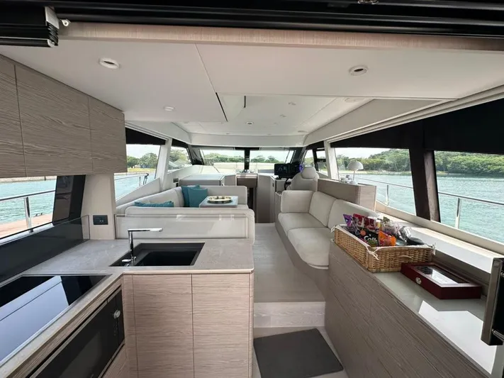  Yacht Photos Pics Luxurious interior of 2023 Ferretti Yachts 500 with modern kitchen and seating area.