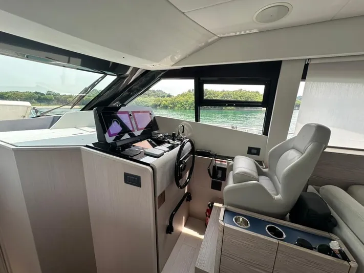  Yacht Photos Pics 2023 Ferretti Yachts 500 helm with modern controls and luxurious seating.