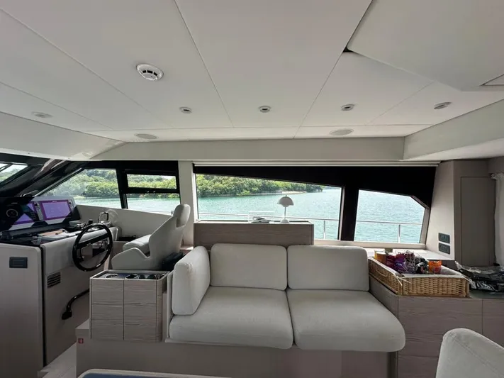  Yacht Photos Pics Interior of 2023 Ferretti Yachts 500, featuring modern helm and comfortable seating.