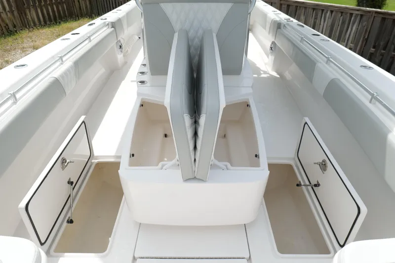  Yacht Photos Pics 2024 Contender 35 ST boat interior with open storage compartments and seating.